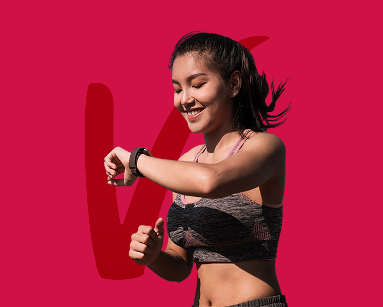 Global experiential marketing agency for AIA Vitality marketing: A smiling woman with sporty top seeing galaxy watch in red background color